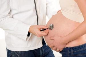 Pregnant Belly With Stethoscope photo