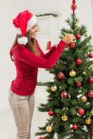 Girl Decorating Christmas Tree photo