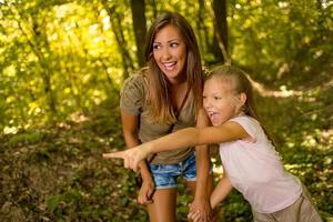 Young Woman And Girl In The Forest photo