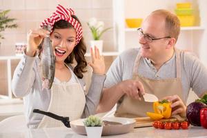 Happy couple in the kitchen photo