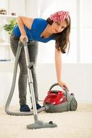 Vacuuming at home photo