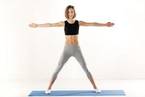 Girl Exercise With Outstretched Arms photo