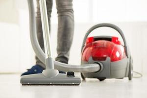 Vacuuming at home photo