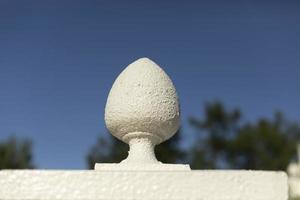 Detail of old architecture of hedge. White fence. photo