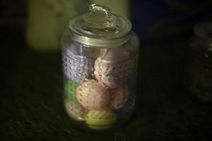 Sweets in park. Sweet treats in glass. Jar with lid. Marshmallow storage. photo