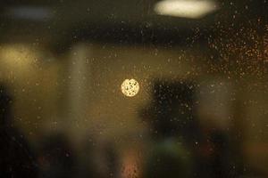 Drops on glass. Wet glass. Rainy weather outside window. photo