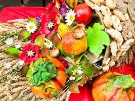 Wheat ears of dry straw of hay collected in a bouquet with seeds and stalks, leaves, fruits, flowers. The background. Texture photo