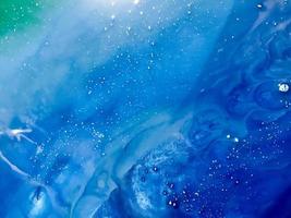 green-blue sea wave with epoxy bubbles. Abstract background on a wooden mold with a marine theme. themes of the underwater world and the ocean on canvas, shot from above photo