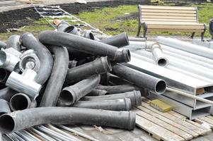 Large black plastic sewer plumbing pipes for the construction of water pipes or sewers at a construction site during the repair photo