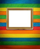 Gold frame on colorful wood Background photo