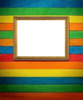 Gold frame on colorful wood Background photo