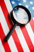 US flag looking through a magnifying glass. Study of the history and culture of the country of the United States. The concept of studying geography, English and customs photo