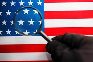 US flag looking through a magnifying glass. Study of the history and culture of the country of the United States. The concept of studying geography, English and customs photo