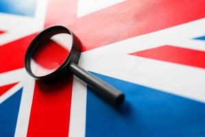 UK flag looking through a magnifying glass. The study of the history and culture of the people of the great country of England. The concept of studying geography, customs and the language photo