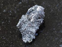 raw hematite ore on dark background photo