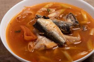 Tom Yum canned fish in a cup. Spicy soup. photo