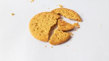 A stack of delicious wheat round biscuits with chocolate filling isolated on white background photo