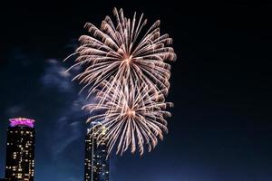 fireworks celebration on the river in the dark sky photo