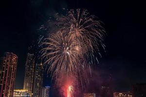 fireworks celebration on the river in the dark sky photo