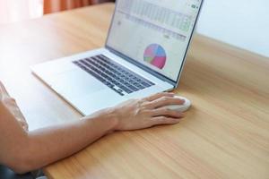 Woman using mouse and laptop computer during working long time on workplace. Wrist pain, De Quervain s tenosynovitis, Ergonomic, Carpal Tunnel Syndrome or Office syndrome concept photo