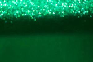 Green shiny blurred bokeh background. Christmas, New Year, Spring or Summer Holidays. Copy space photo