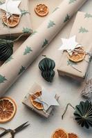 Christmas  gift boxes, clews of rope, paper's rools and decorations. photo
