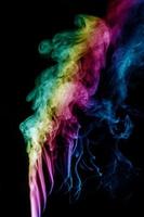 Abstract smoke isolated on black background,Rainbow powder photo