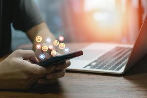 man using mobile smart phone Social media chat message and Marketing network internet online concept. photo