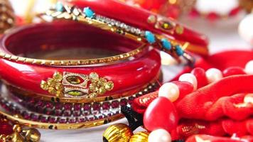 Close up of red bracelets, colorful jewelry video