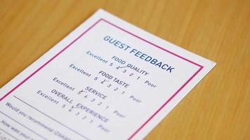 Guest feedback paper chart, close up, restaurant review video