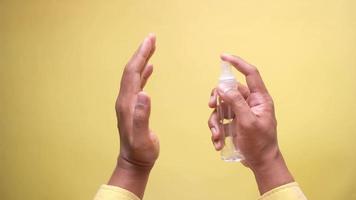 Sanitizing hands with alcohol spray video