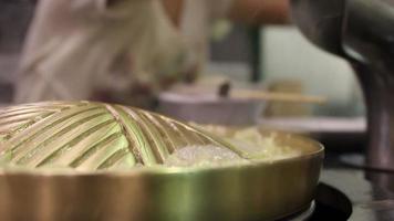 brass pan with boiled vegetable before cooking video