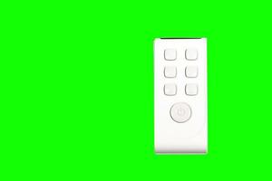 Remote control isolated on green background with clipping path. photo