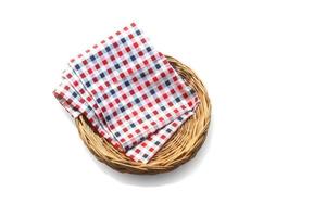 Wicker basket with cloth isolated on white background with clipping path. Top view. photo