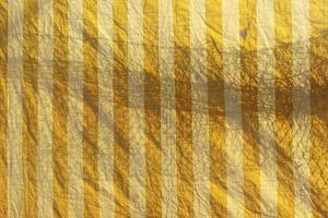 Plastic sheet pattern with shadow of net. Abstract background. photo