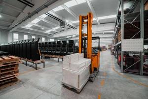 Forklift loader in storage warehouse ship yard. Distribution products. Delivery. Logistics. Transportation. Business background photo