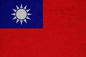 Taiwan flag on a textured background. Concept collage. photo