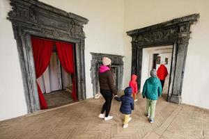 Mother with four kids visit Pidhirtsi Castle indoor museum, Lviv region, Ukraine. Family tourist. photo