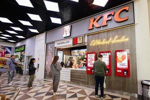 People Buying Fried Chicken At A Local Kentucky Fried Chicken Restaurant. photo