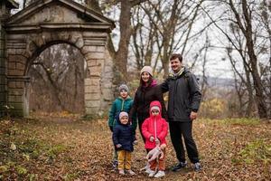 Family near ruins arch of Pidhirtsi Castle, Lviv region, Ukraine. photo