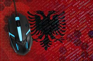 Albania flag  and computer mouse. Digital threat, illegal actions on the Internet photo