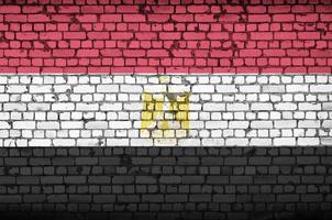 Egypt flag is painted onto an old brick wall photo