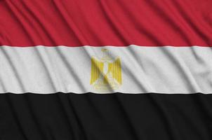 Egypt flag  is depicted on a sports cloth fabric with many folds. Sport team banner photo