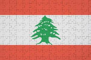 Lebanon flag  is depicted on a folded puzzle photo