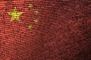 China flag  is depicted on the screen with the program code. The concept of modern technology and site development photo