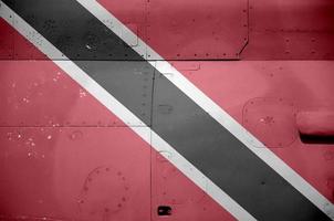 Trinidad and Tobago flag depicted on side part of military armored helicopter closeup. Army forces aircraft conceptual background photo