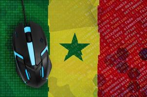 Senegal flag  and computer mouse. Digital threat, illegal actions on the Internet photo