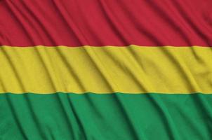 Bolivia flag  is depicted on a sports cloth fabric with many folds. Sport team banner photo