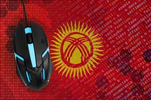 Kyrgyzstan flag  and computer mouse. Digital threat, illegal actions on the Internet photo