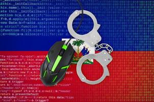 Haiti flag  and handcuffed computer mouse. Combating computer crime, hackers and piracy photo
